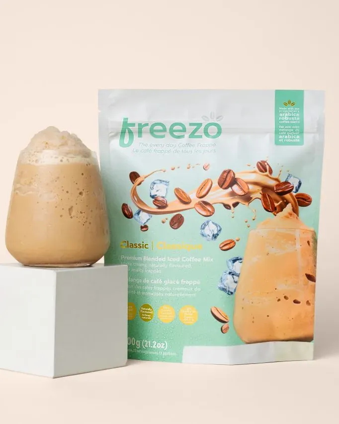 Freezo coffee frappe mix pouch beside a finished frappe